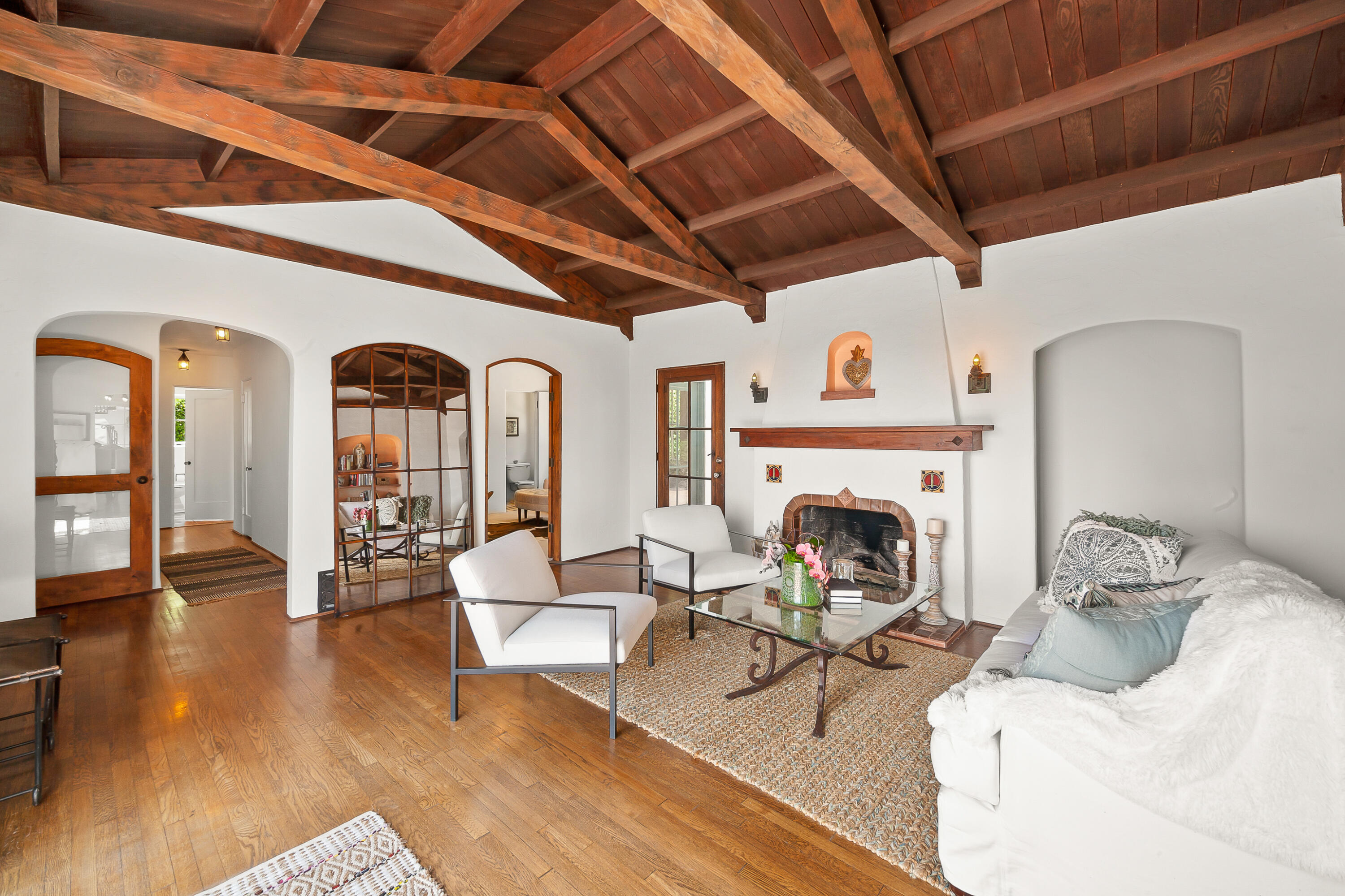 870 Windsor Way Santa Barbara, CA 93105 - Photo 27 of 59 a living room with furniture a fireplace and wooden floor