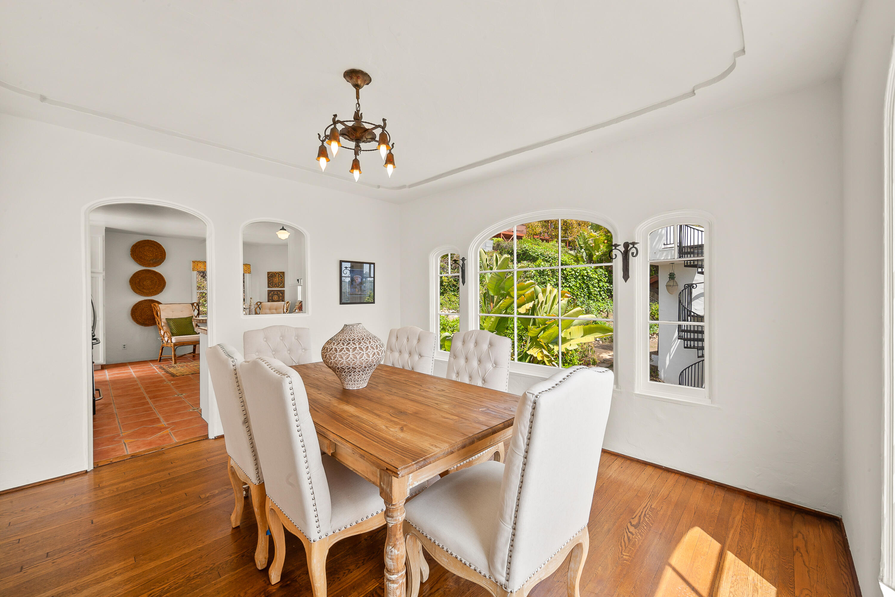 870 Windsor Way Santa Barbara, CA 93105 - Photo 30 of 59 a view of a dining room with furniture a chandelier and wooden floor