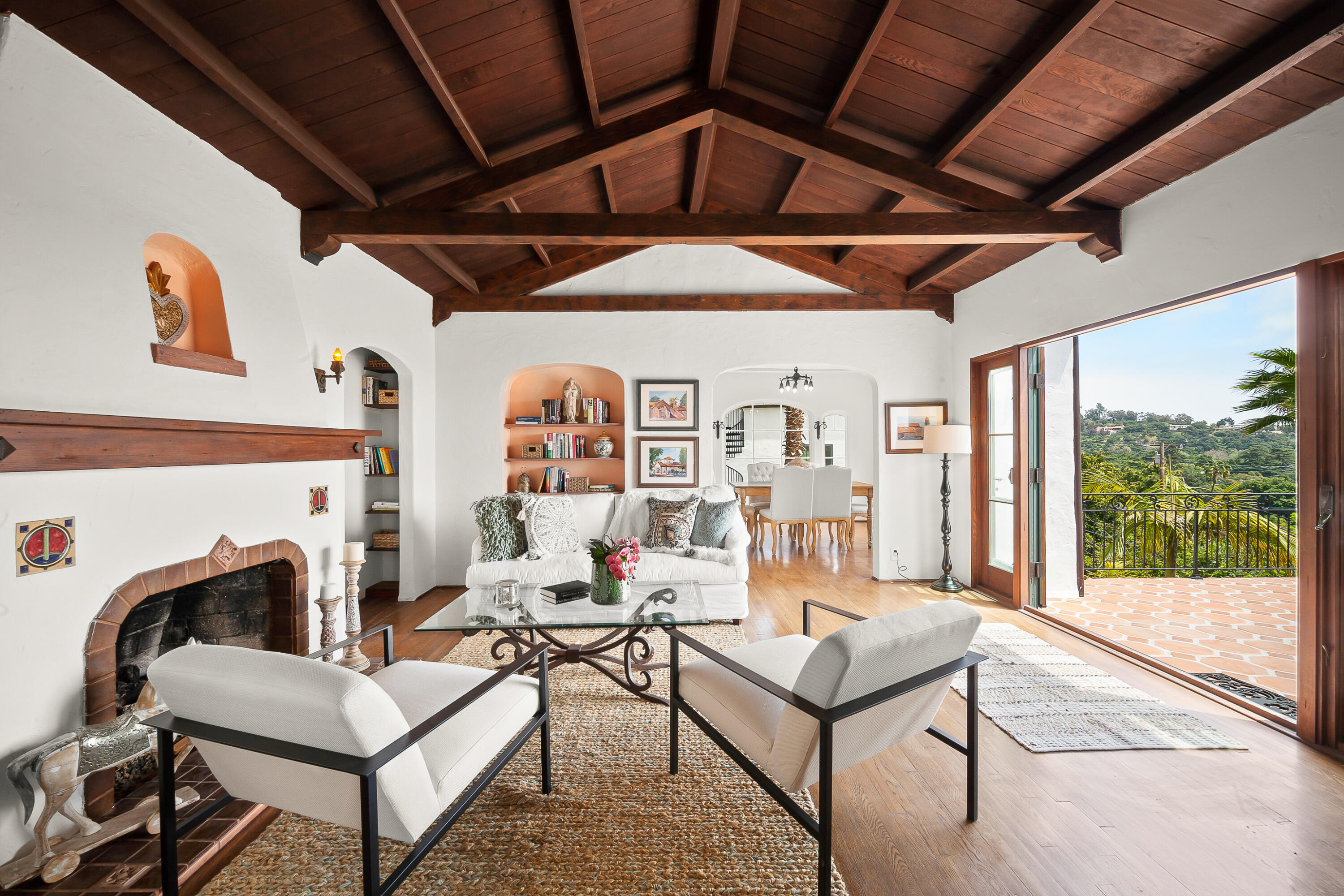 870 Windsor Way Santa Barbara, CA 93105 - Photo 3 of 59 a living room with furniture a fireplace and a table