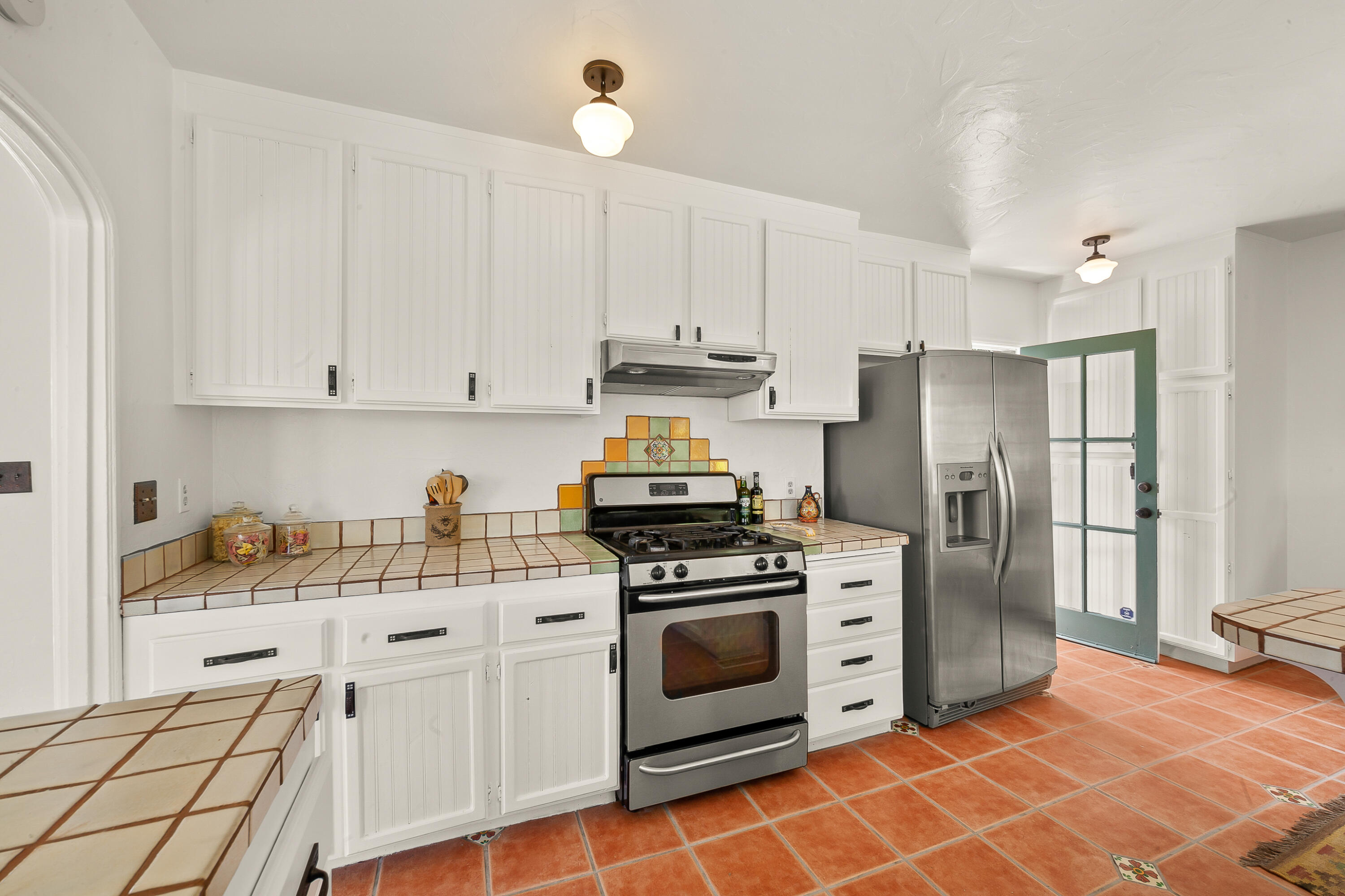 870 Windsor Way Santa Barbara, CA 93105 - Photo 33 of 59 a kitchen with cabinets stainless steel appliances and wooden floor