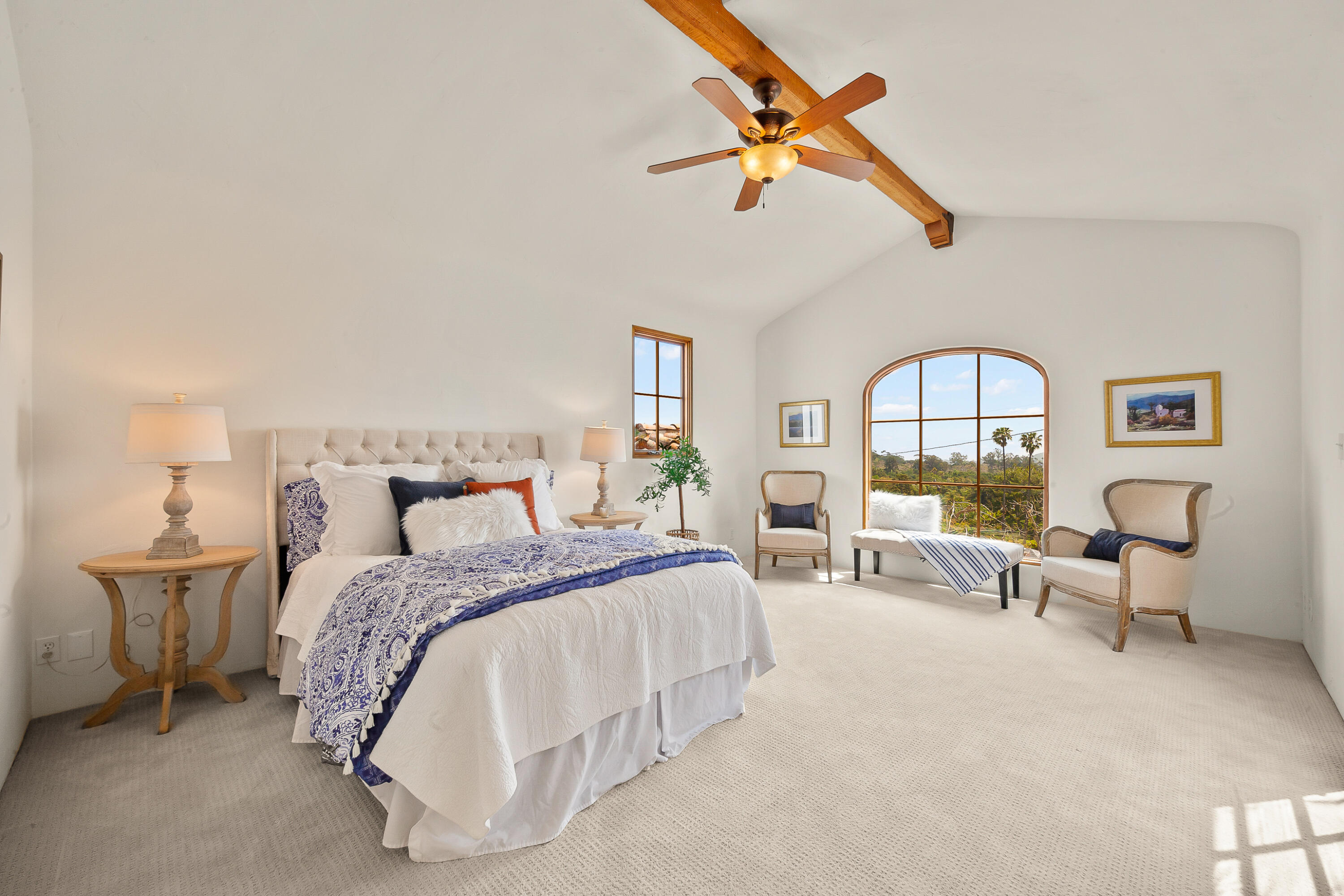 870 Windsor Way Santa Barbara, CA 93105 - Photo 36 of 59 a spacious bedroom with a bed couch and a window