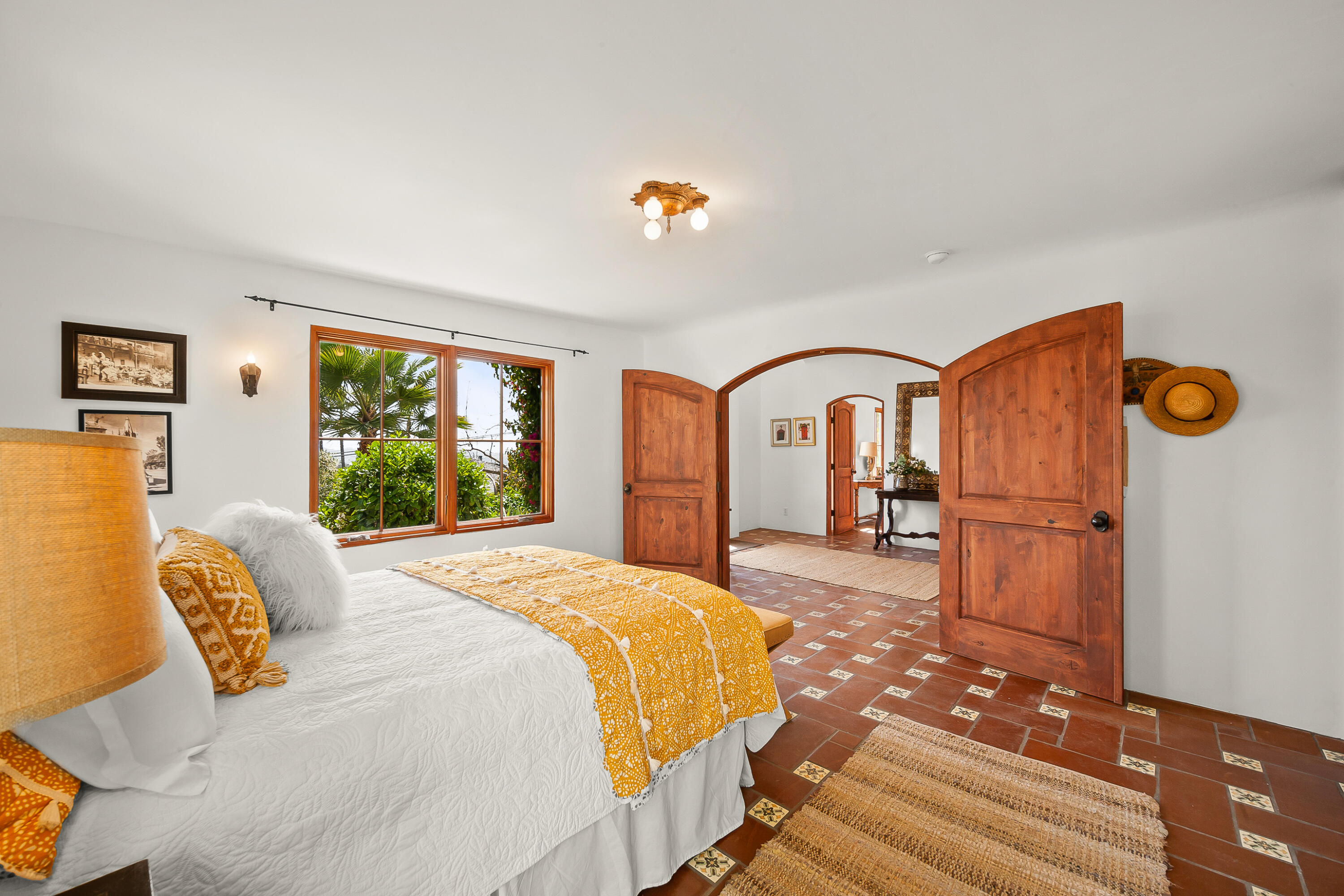 870 Windsor Way Santa Barbara, CA 93105 - Photo 38 of 59 a spacious bedroom with a bed a dresser and window