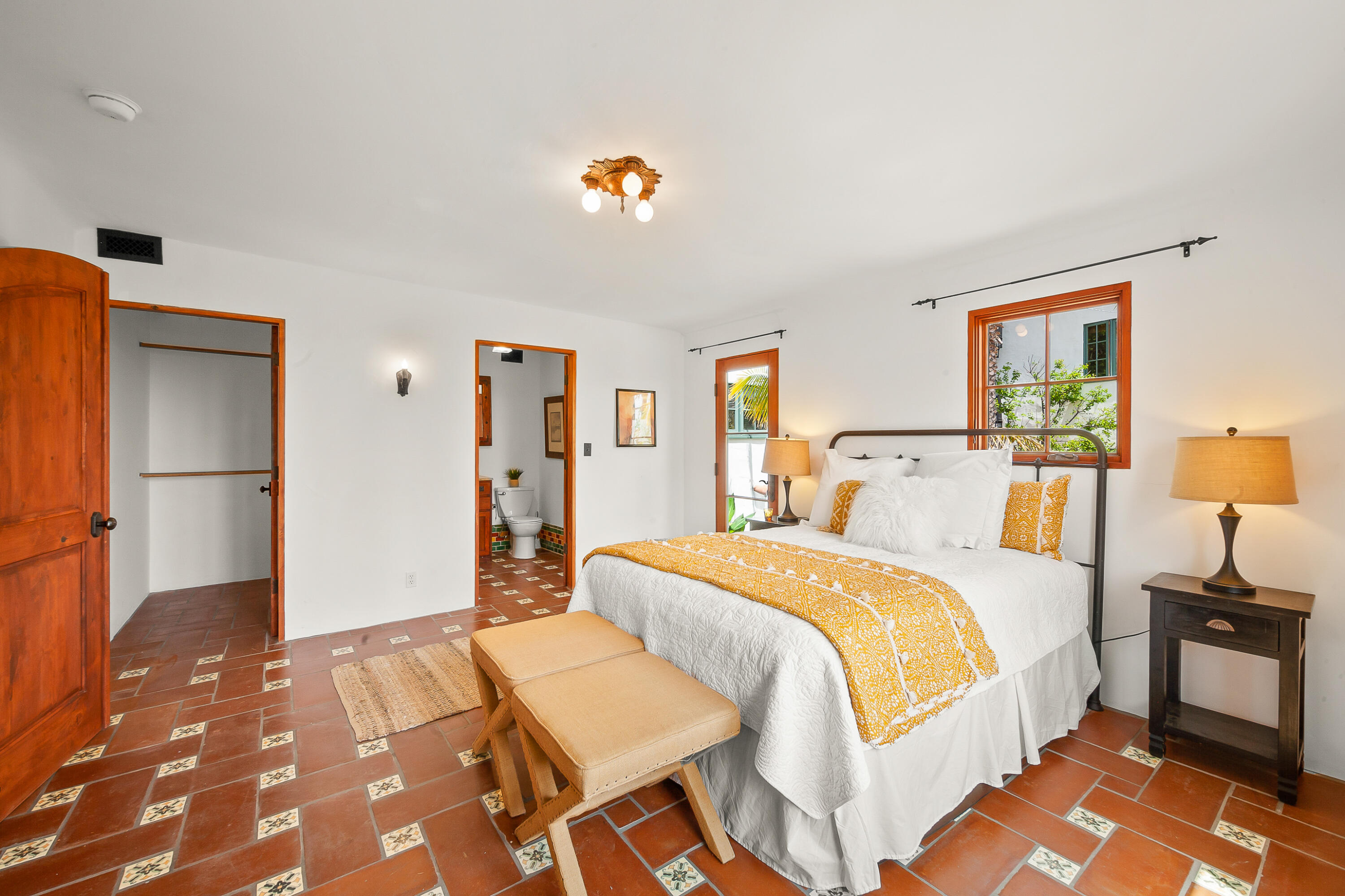 870 Windsor Way Santa Barbara, CA 93105 - Photo 39 of 59 a bedroom with a bed and a chandelier