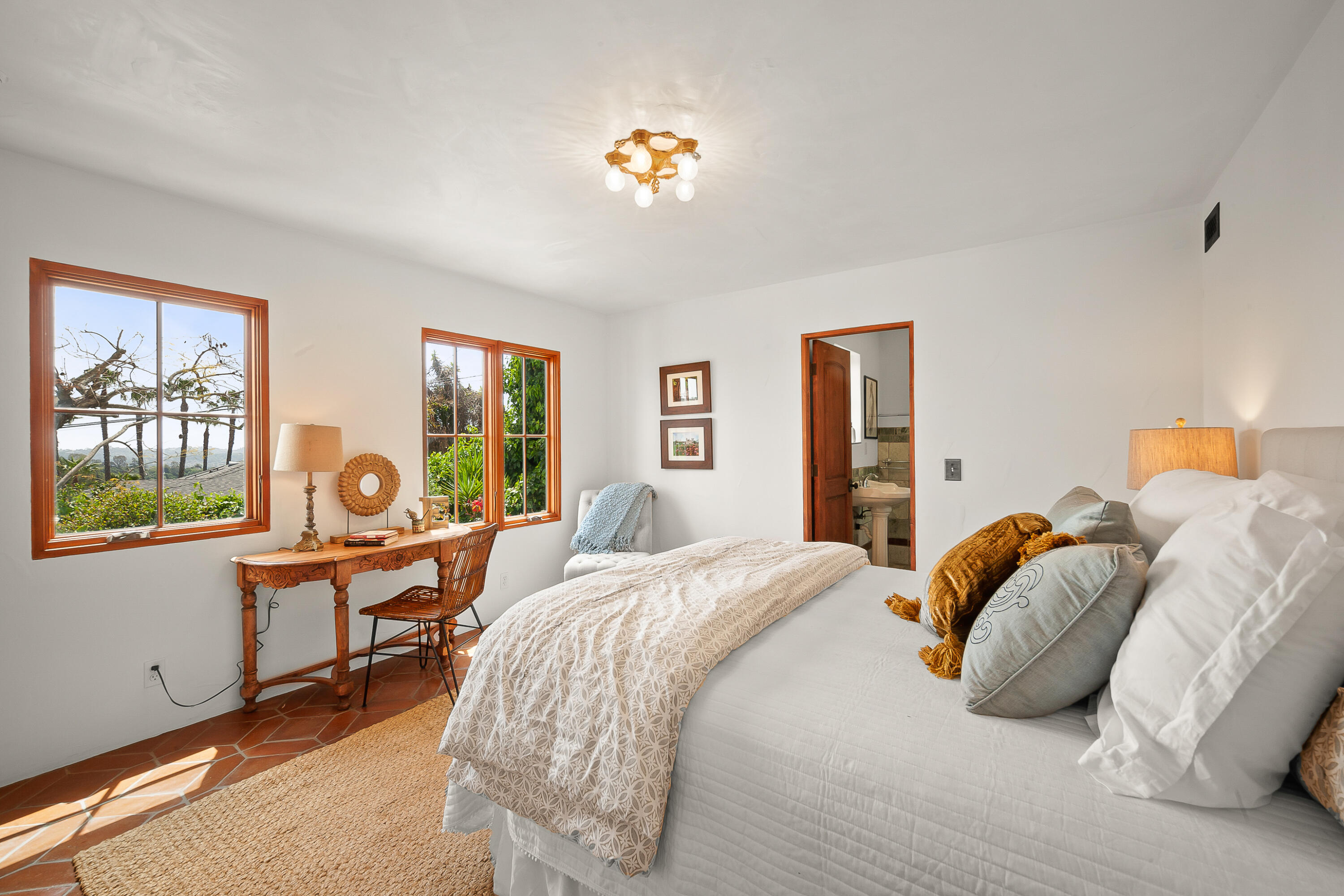 870 Windsor Way Santa Barbara, CA 93105 - Photo 41 of 59 a bedroom with a bed and a large window