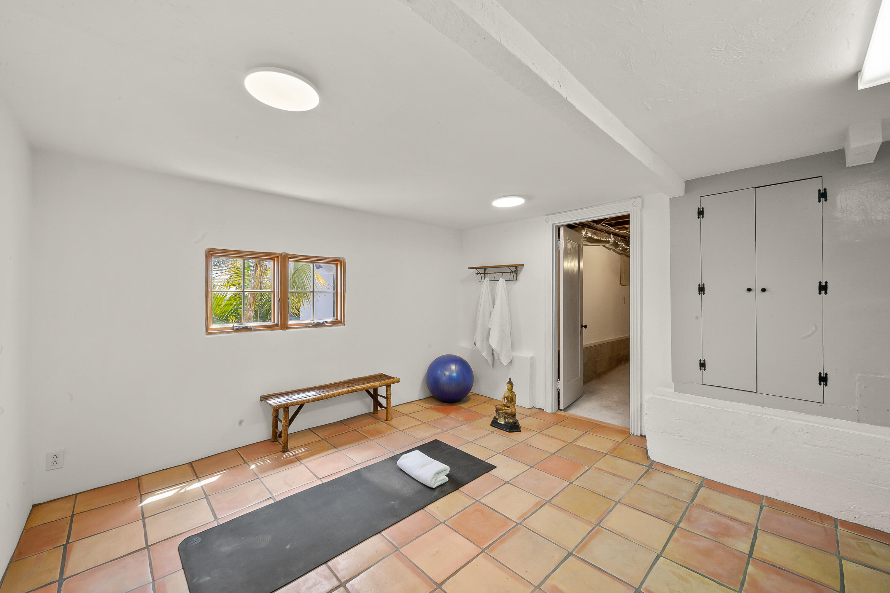 870 Windsor Way Santa Barbara, CA 93105 - Photo 51 of 59 a bedroom with a bed and a chandelier