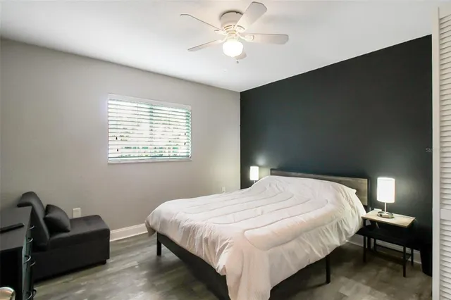 a bedroom with a bed and a couch