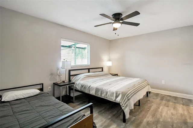 a bedroom with a bed and window