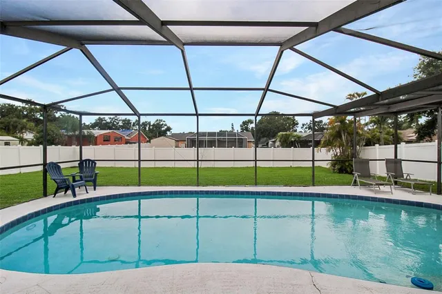 a view of a swimming pool with a porch
