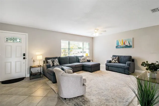 a living room with furniture and a window