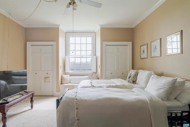 a front view of a house with outdoor seating