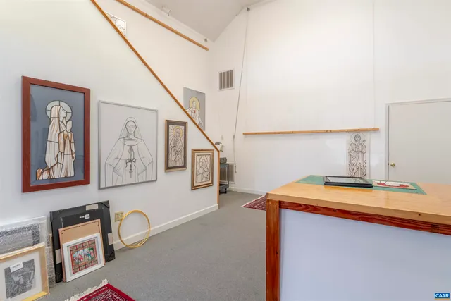 a view of a backyard with plants and lake view