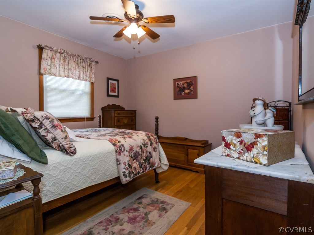 2209 Staten Road Chester, VA 23831 - Photo 13 of 24 a bedroom with a bed and ceiling fan