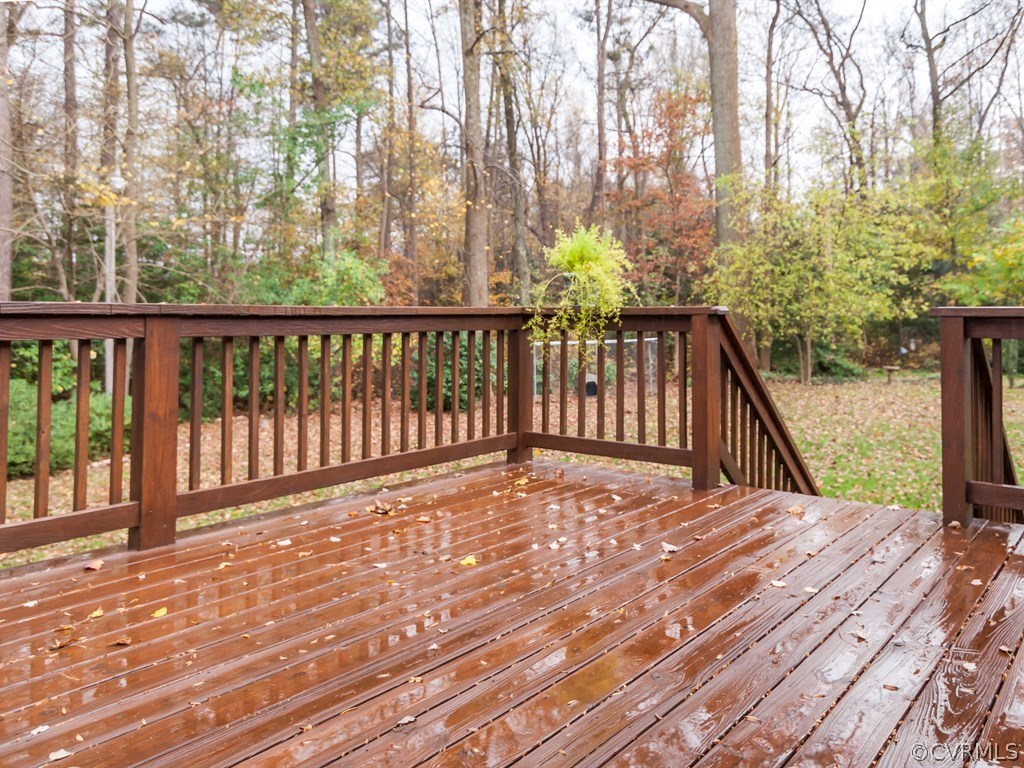 2209 Staten Road Chester, VA 23831 - Photo 23 of 24 a view of a balcony with wooden floor and fence