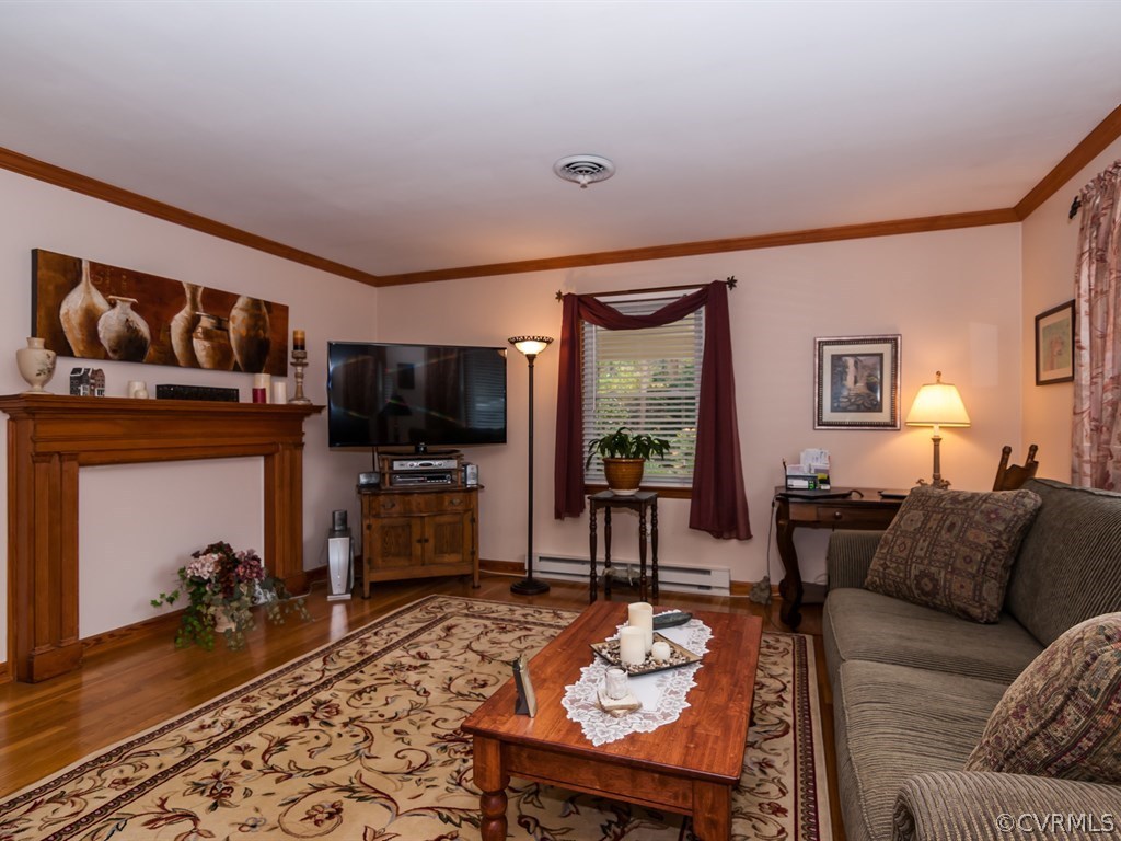 2209 Staten Road Chester, VA 23831 - Photo 3 of 24 a living room with furniture and a flat screen tv