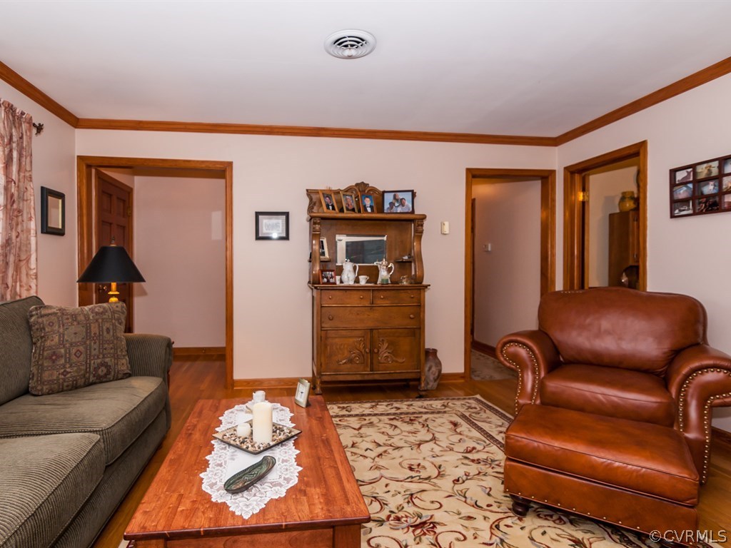 2209 Staten Road Chester, VA 23831 - Photo 5 of 24 a living room with furniture and wooden floor