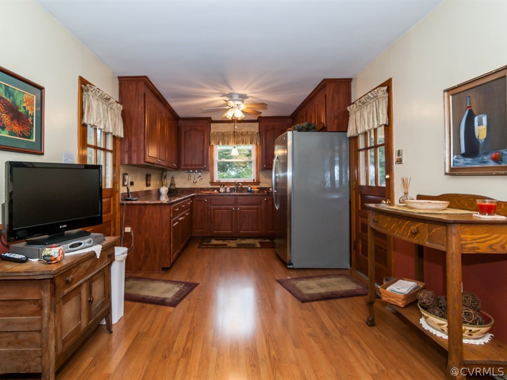 2209 Staten Road Chester, VA 23831 - Photo 6 of 24 a kitchen with stainless steel appliances granite countertop a refrigerator stove top oven and sink