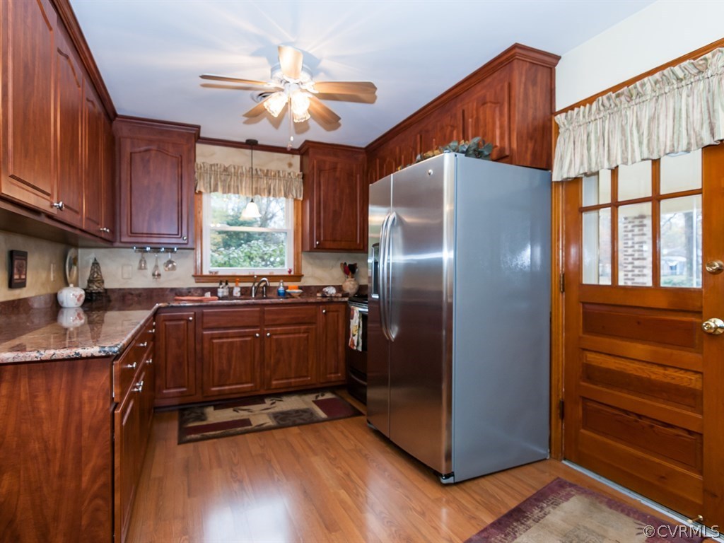 2209 Staten Road Chester, VA 23831 - Photo 8 of 24 a kitchen with refrigerator and window