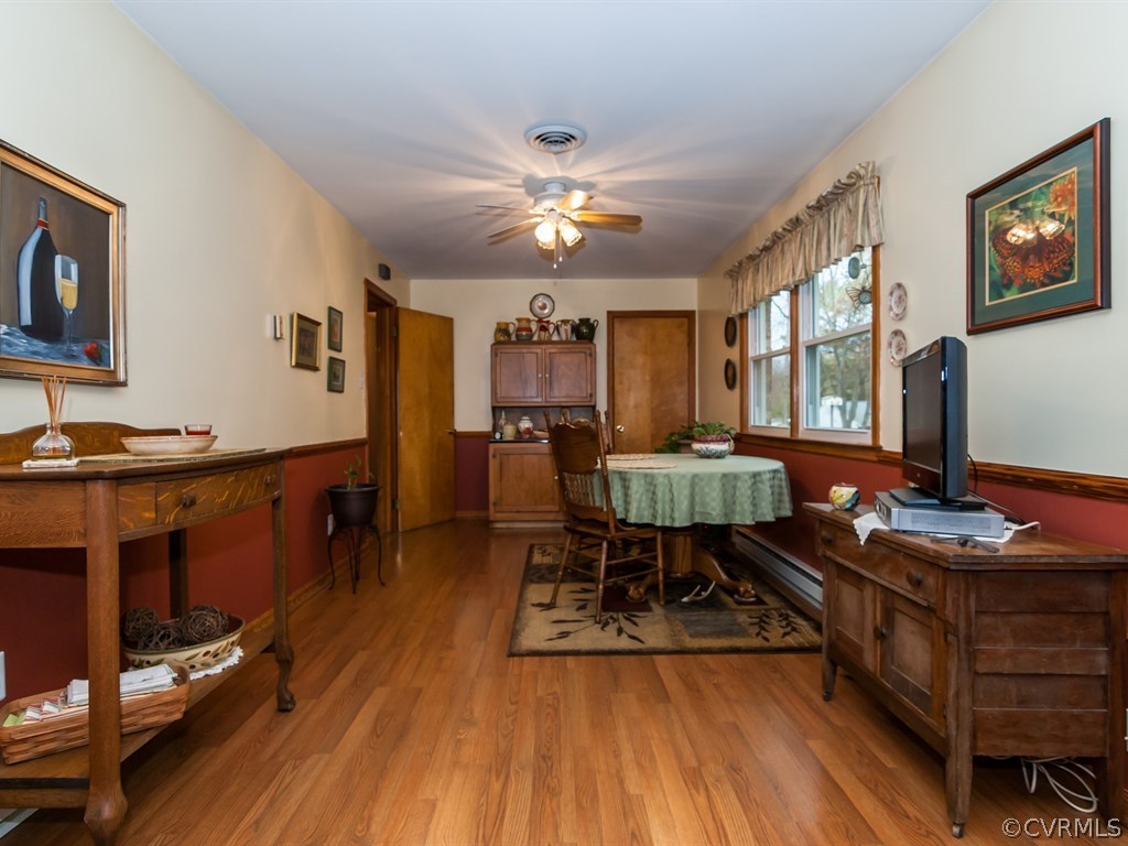 2209 Staten Road Chester, VA 23831 - Photo 9 of 24 a workspace with furniture and wooden floor
