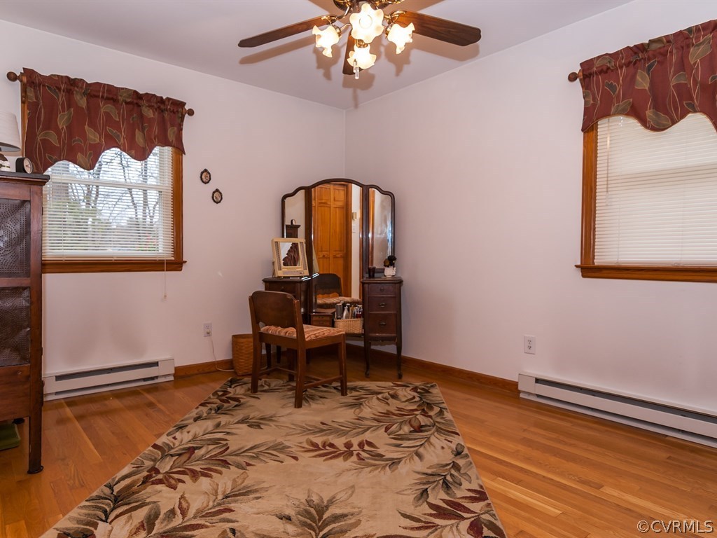 2209 Staten Road Chester, VA 23831 - Photo 10 of 24 a view of a room with a table chairs and wooden floor