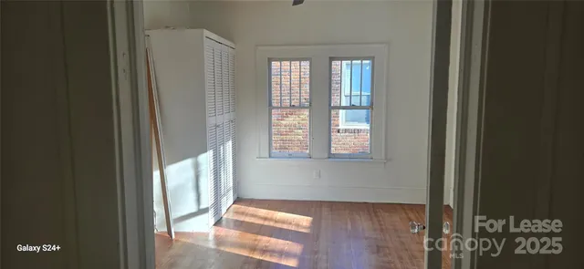 a view of a hallway with windows