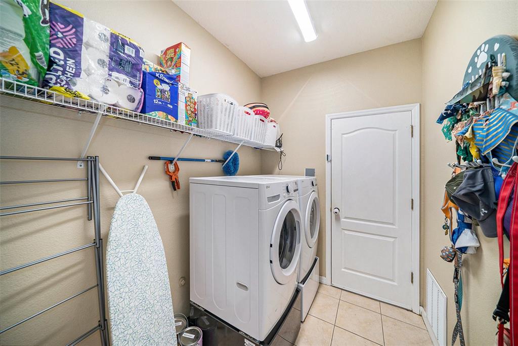 12045 Colony Lakes Boulevard New Port Richey, FL 34654 - Photo 16 of 22 a utility room with dryer and washer