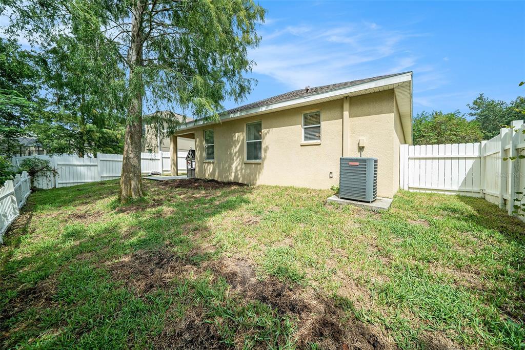 12045 Colony Lakes Boulevard New Port Richey, FL 34654 - Photo 19 of 22 front view of a house with a yard