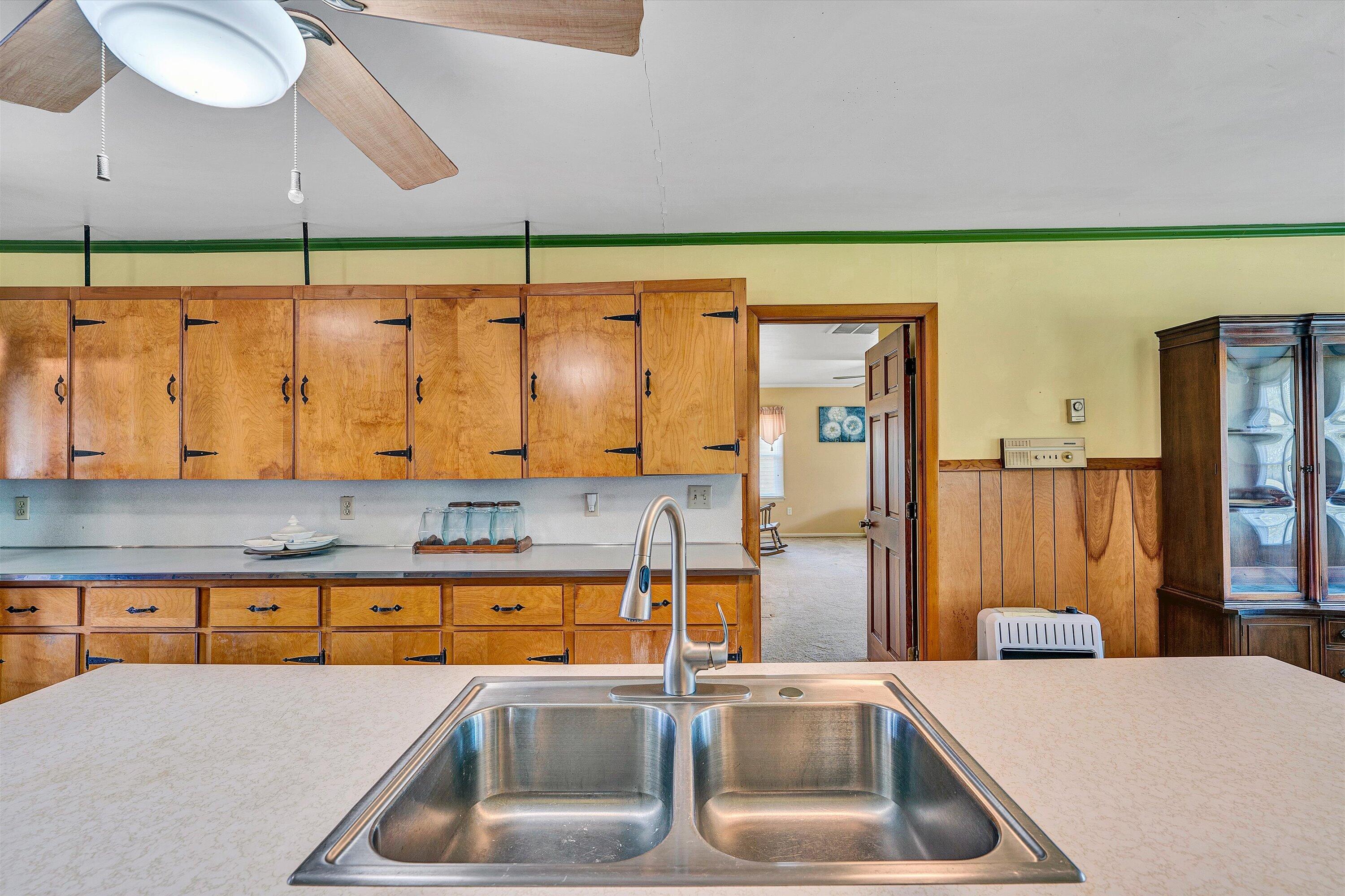 3673 Mt Zion Road Blacksburg, VA 24060 - Photo 19 of 51 a kitchen with a sink a counter top space and cabinets