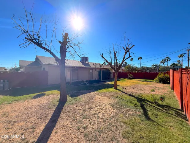 a view of a backyard of the house