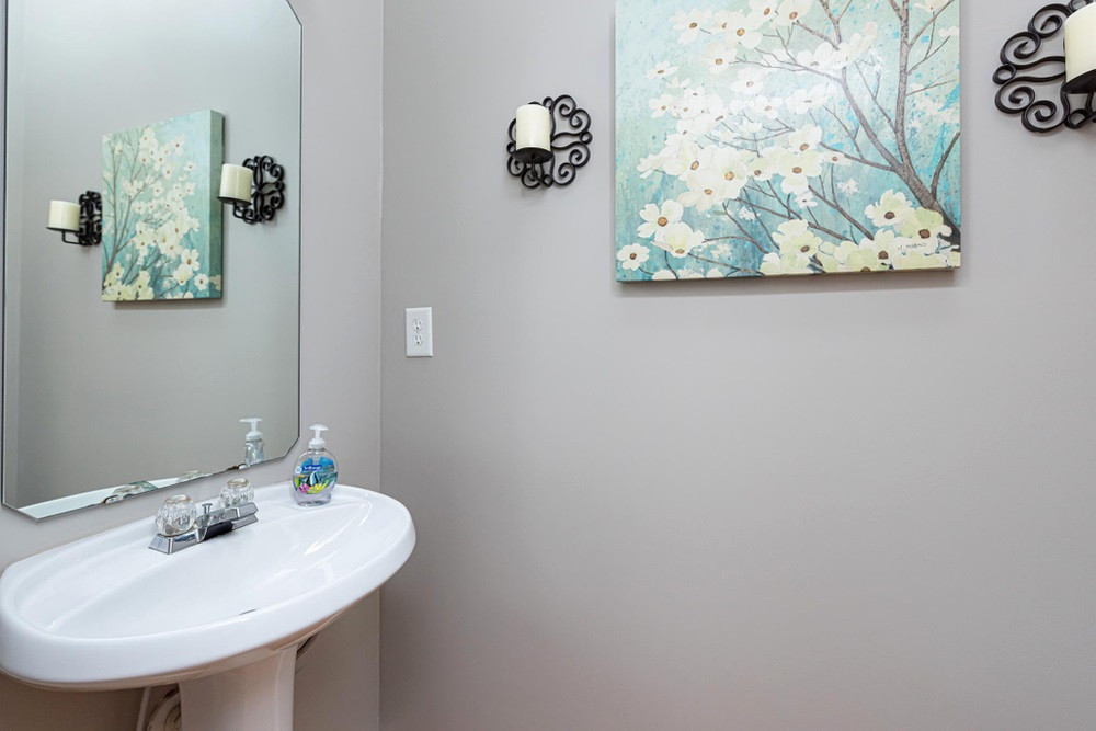 8451 Reedy Ridge Lane Raleigh, NC 27613 - Photo 11 of 30 Half bath on main floor with pedastal sink. Main Level Half Bath