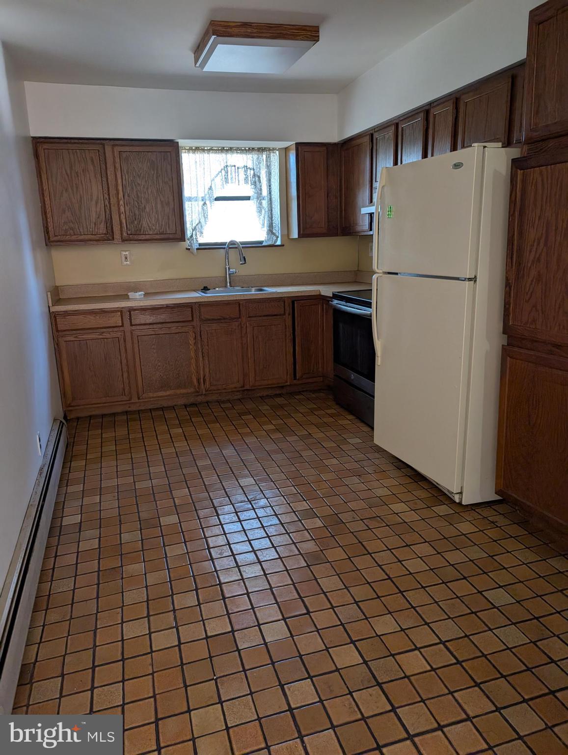 2258 State Rd. Bensalem, PA 19020 - Photo 3 of 13 a kitchen with stainless steel appliances a refrigerator sink and cabinets