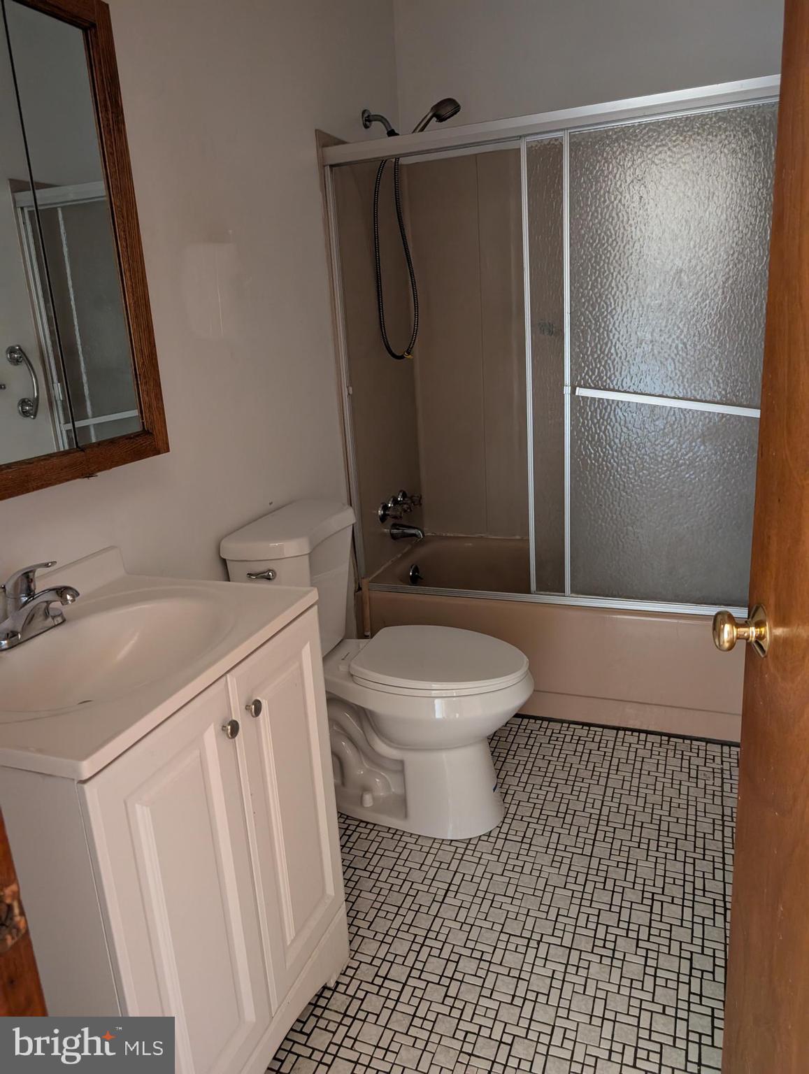 2258 State Rd. Bensalem, PA 19020 - Photo 7 of 13 a bathroom with a granite countertop sink toilet and shower