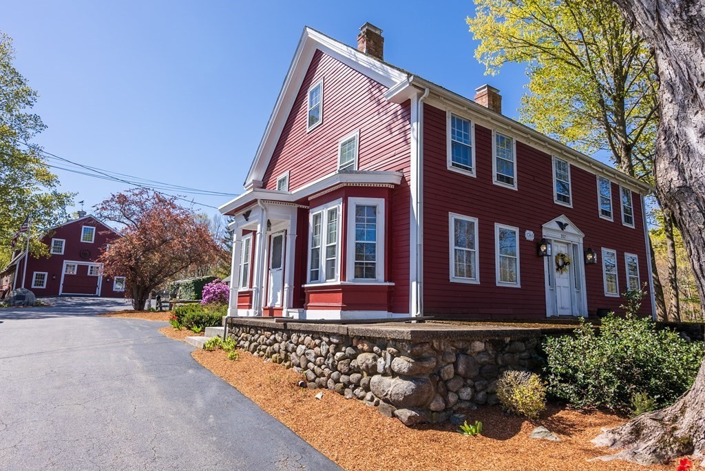 357 Commonwealth Road Wayland, MA 01778 - Photo 1 of 33 a front view of a house with a yard