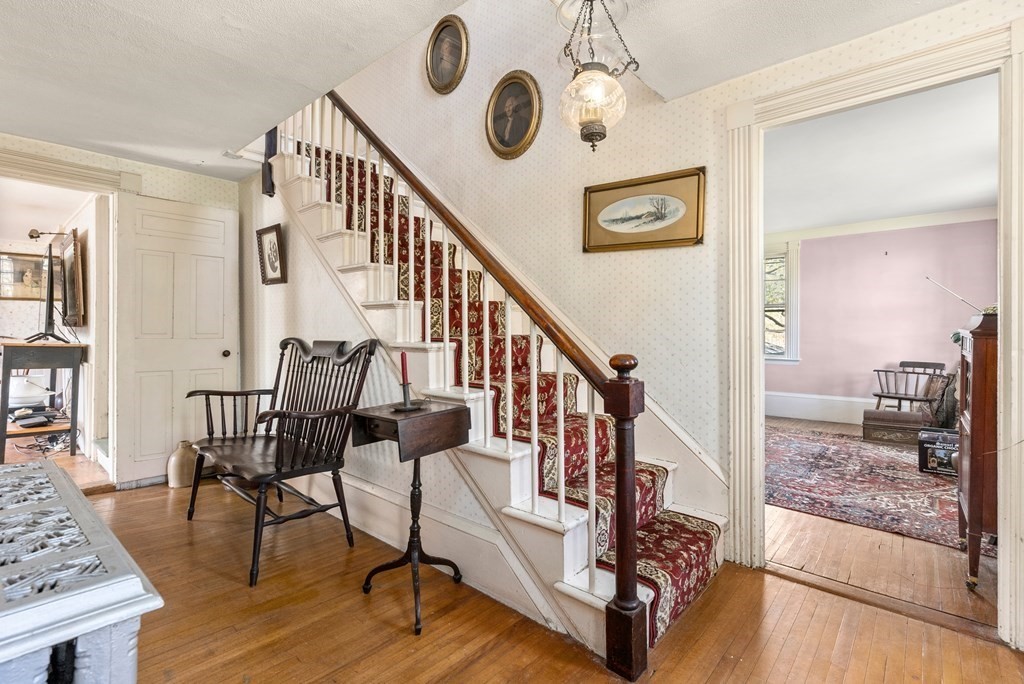 357 Commonwealth Road Wayland, MA 01778 - Photo 15 of 33 a view of a hallway with wooden floor and stairs