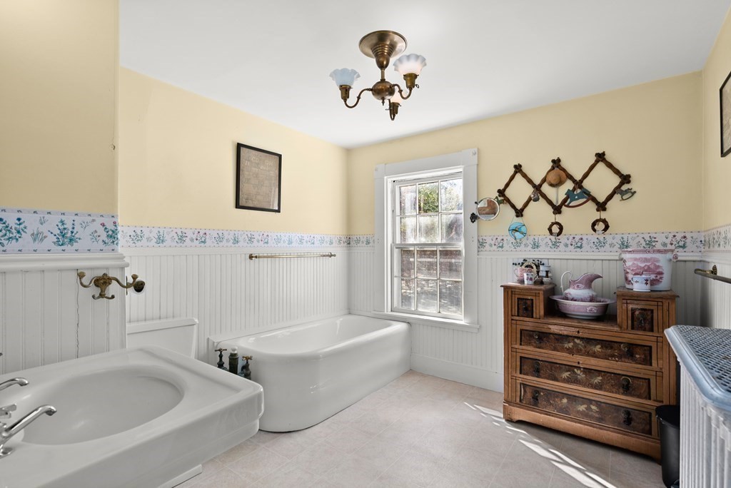 357 Commonwealth Road Wayland, MA 01778 - Photo 18 of 33 a bathroom with a tub sink and mirror