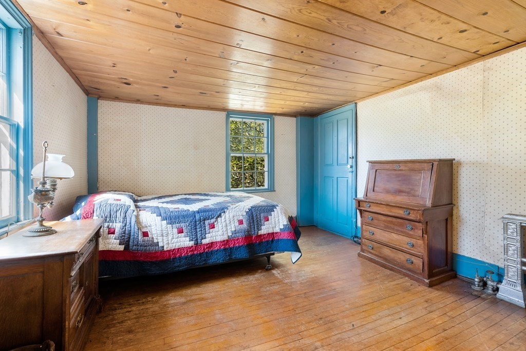 357 Commonwealth Road Wayland, MA 01778 - Photo 20 of 33 a bedroom with a bed and a baby crib