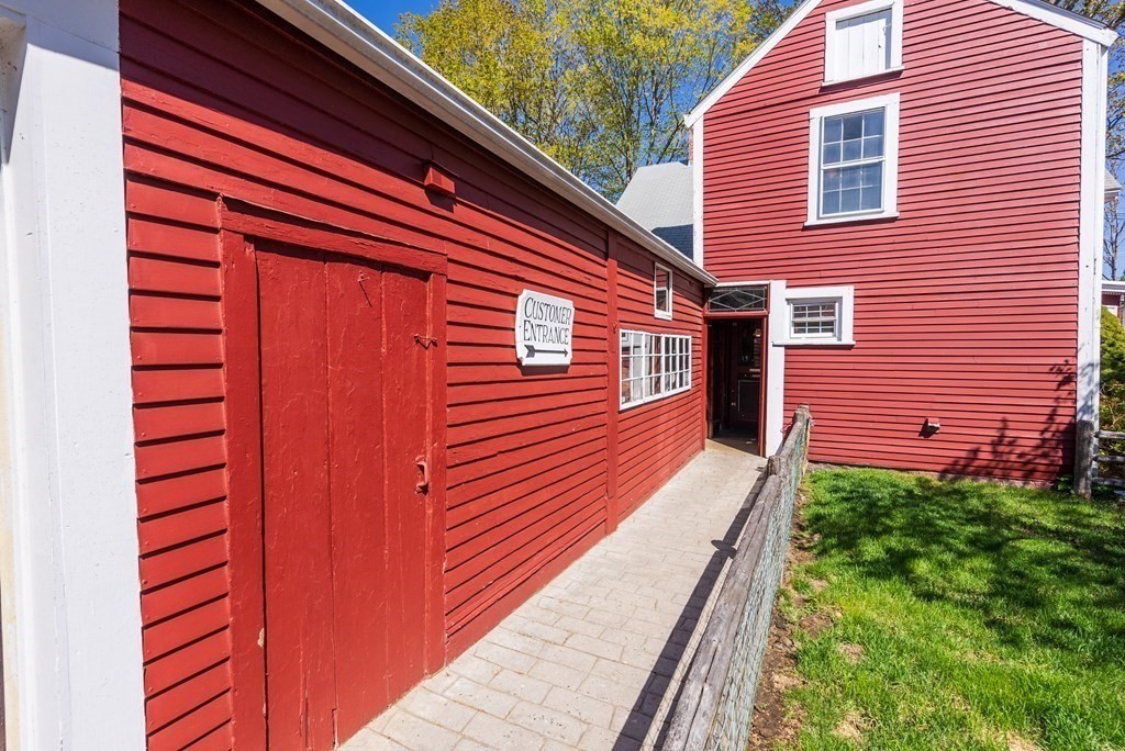 357 Commonwealth Road Wayland, MA 01778 - Photo 22 of 33 a front view of a house with a yard