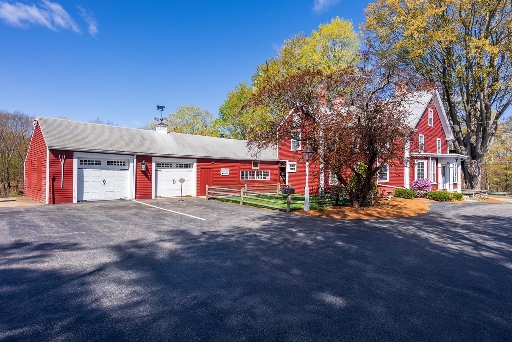 357 Commonwealth Road Wayland, MA 01778 - Photo 7 of 33 a view of a house with a yard and garage