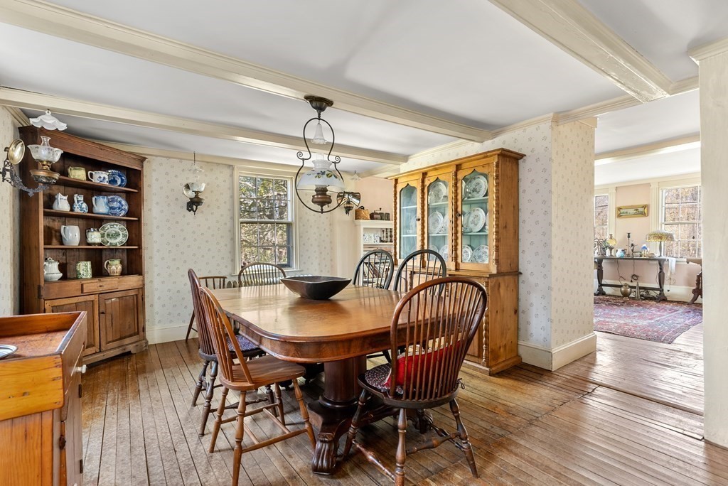 357 Commonwealth Road Wayland, MA 01778 - Photo 9 of 33 a dining room with furniture a chandelier and wooden floor