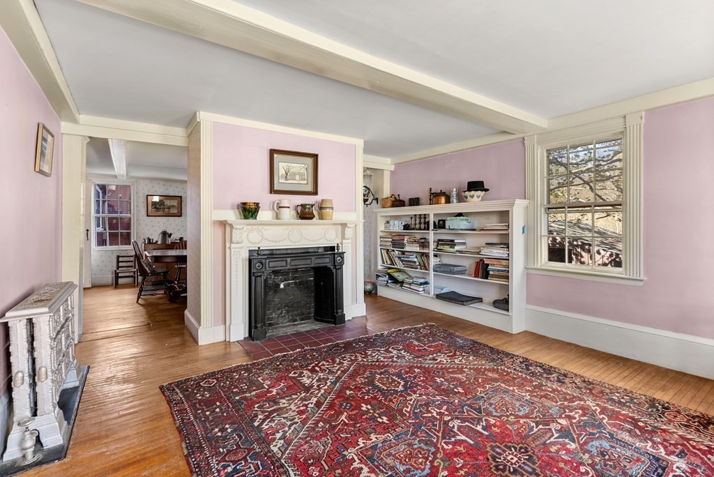 357 Commonwealth Road Wayland, MA 01778 - Photo 10 of 33 a living room with furniture and a fireplace