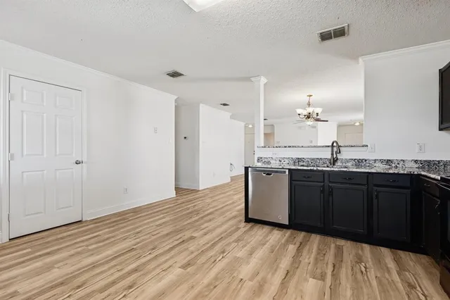 a spacious bathroom with a granite countertop sink