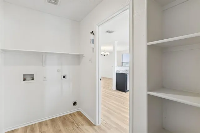 a view of a backyard with table and chairs with wooden fence