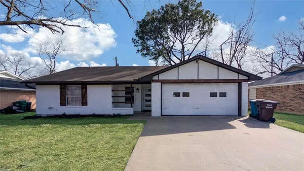 a view of a house with a sink and a yard