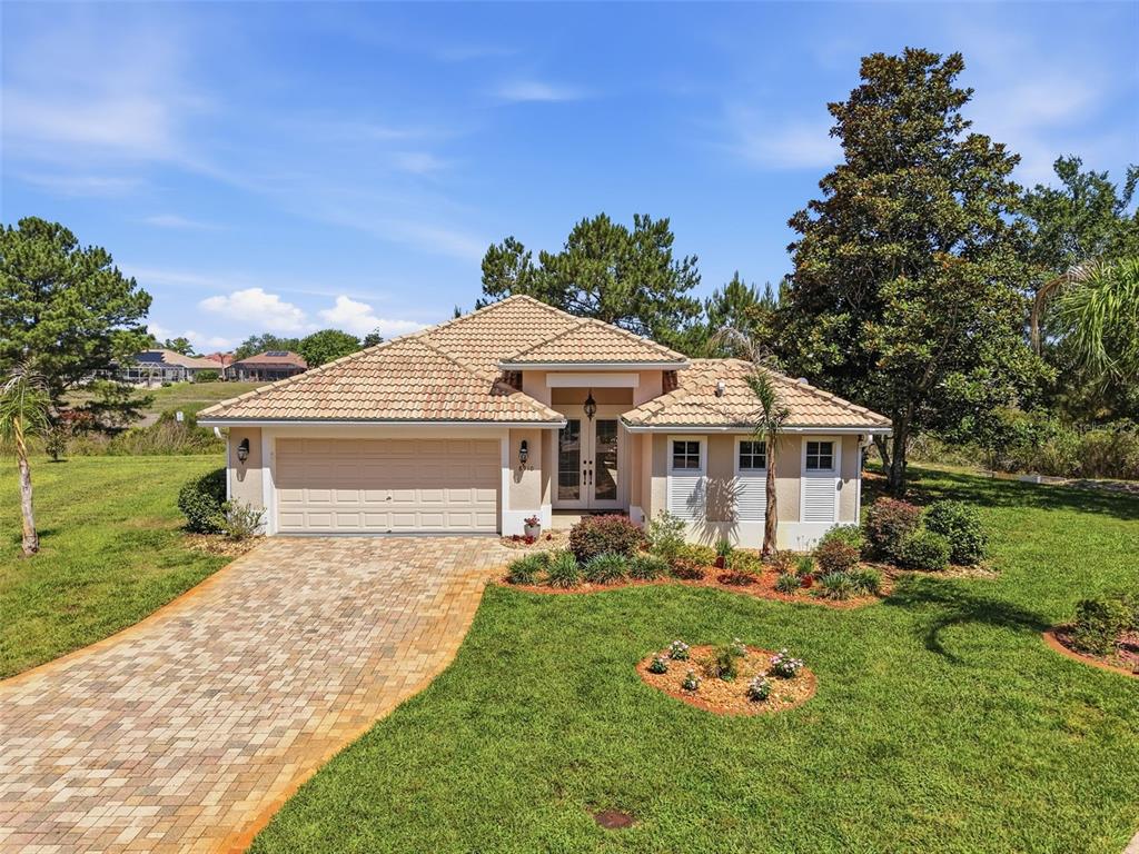 8910 Jericho Road Weeki Wachee, FL 34613 - Photo 49 of 52 a front view of a house with garden