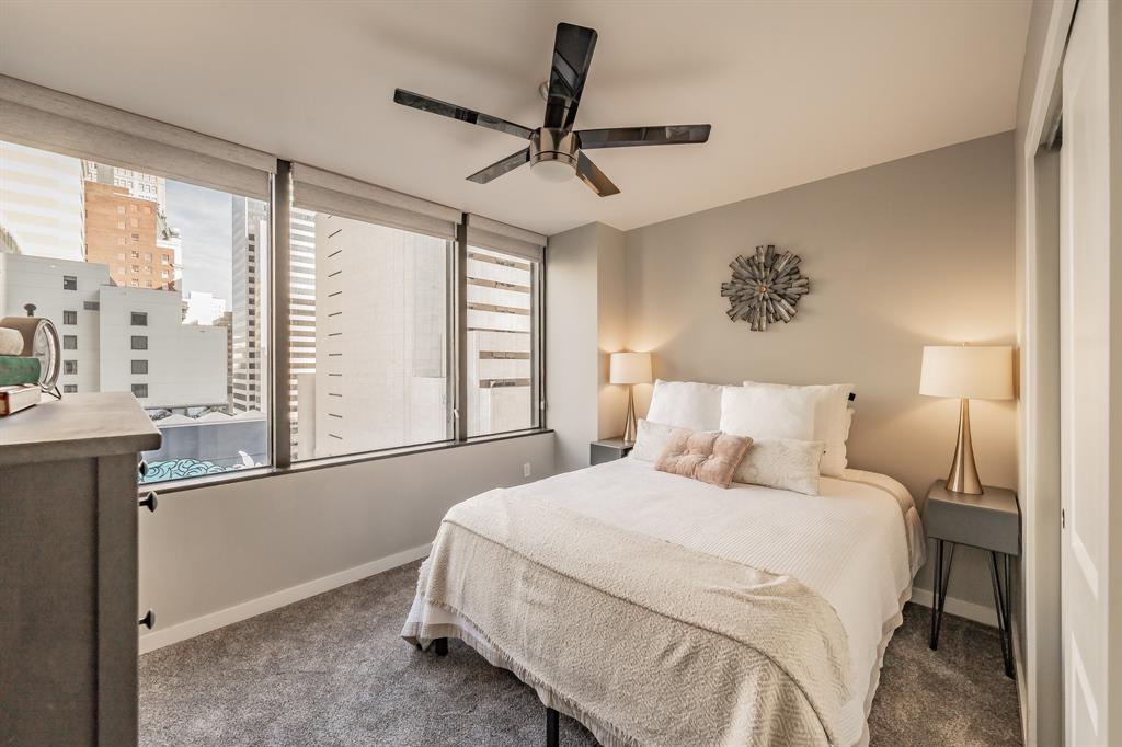 1200 Main Street, Unit 812 Dallas, TX 75202 - Photo 5 of 17 a bedroom with a large bed and a window