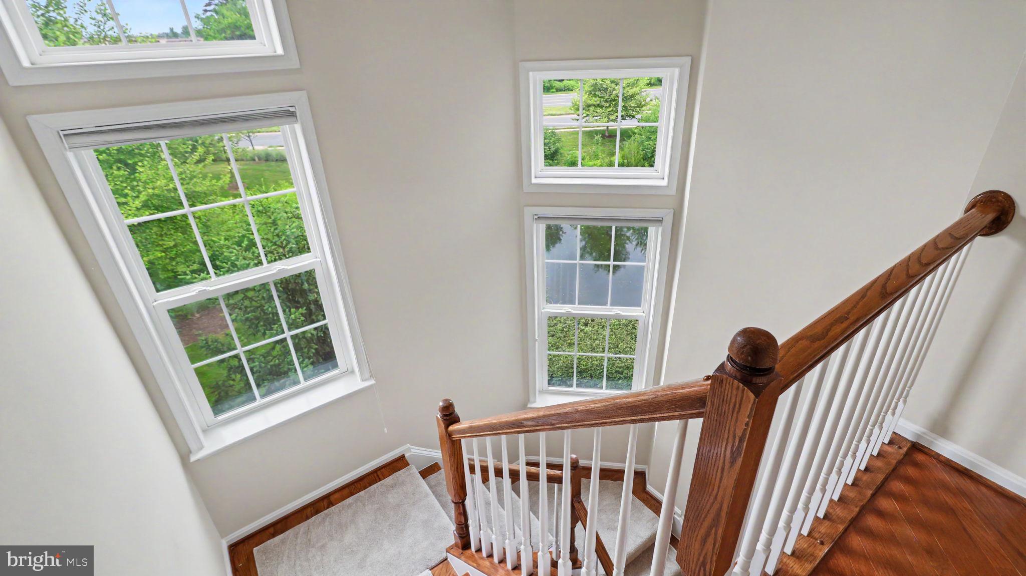42371 Trellis Square Brambleton, VA 20148 - Photo 47 of 70 Bright stairwell with scenic views.