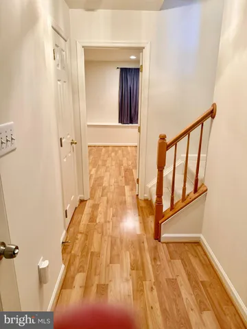 wooden floor with a bathroom