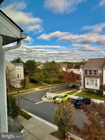 a view of a swimming pool with an outdoor seating