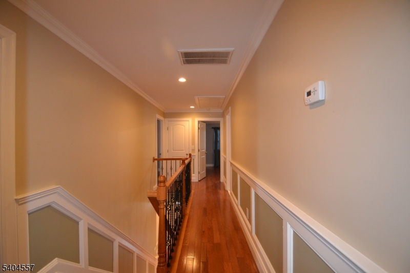 204 Market Street Garfield, NJ 07026 - Photo 17 of 36 a view of a hallway with stairs