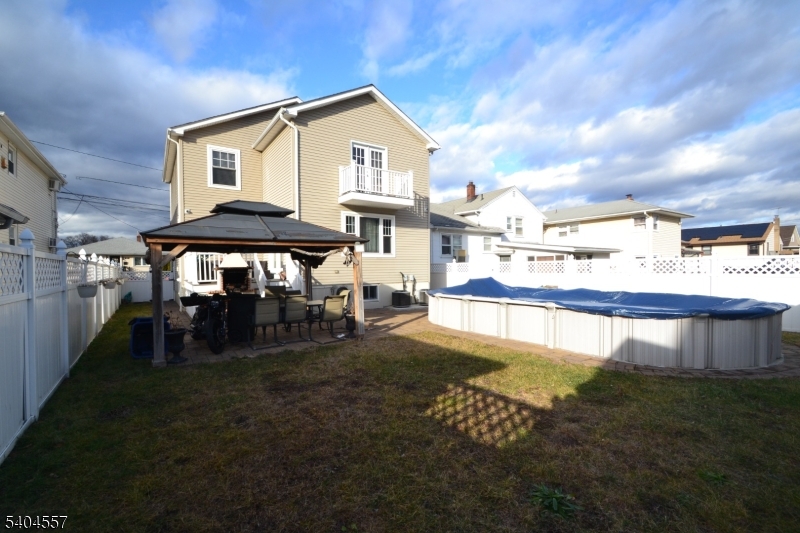 204 Market Street Garfield, NJ 07026 - Photo 5 of 36 a view of a house with a yard balcony and sitting area