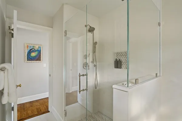 a bathroom with a shower and a sink